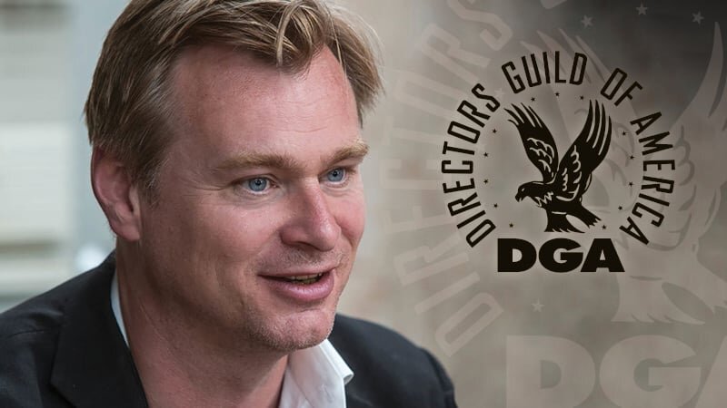 Christopher Nolan speaking at a podium.