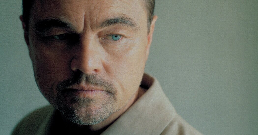 Leonardo DiCaprio in moody profile close-up.
