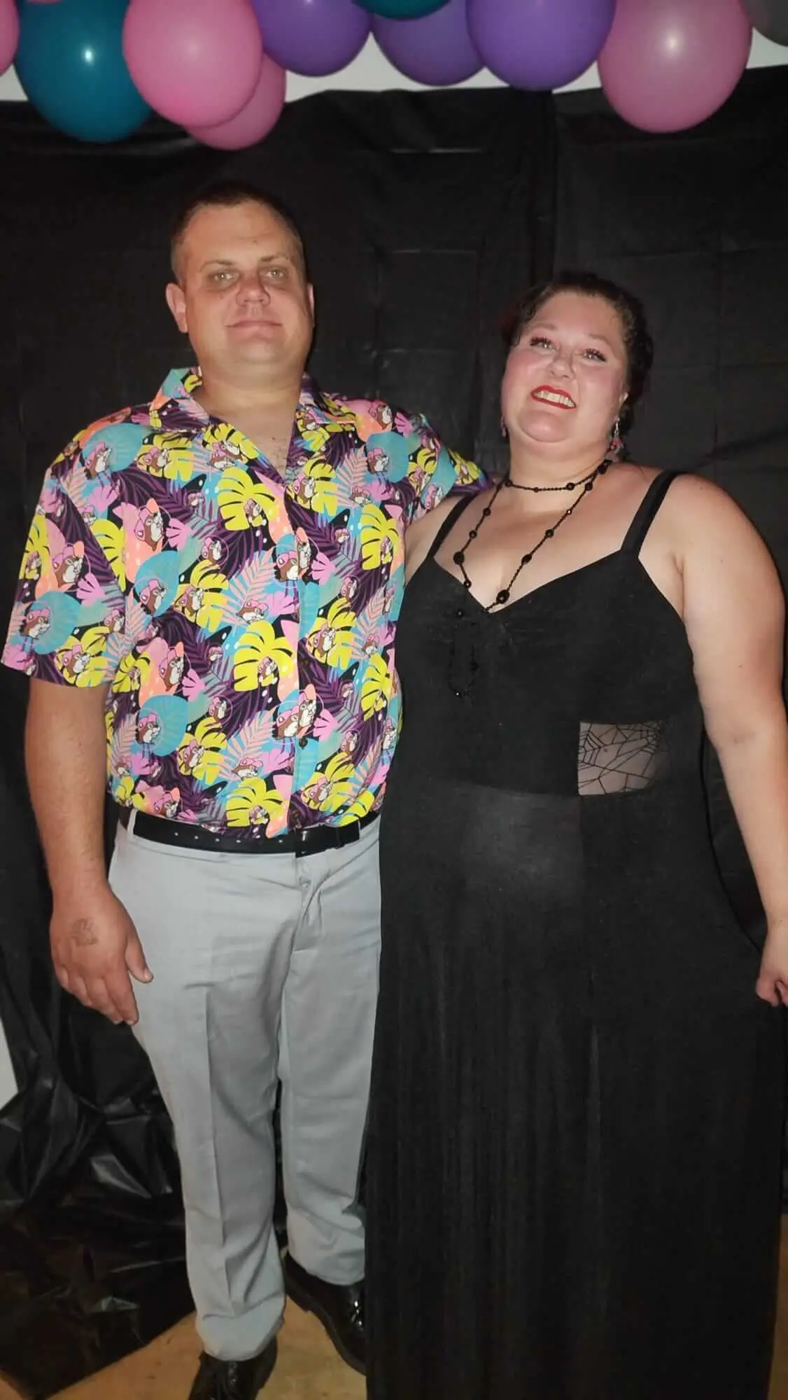 Two Dancewave guests pose together in colorful party attire