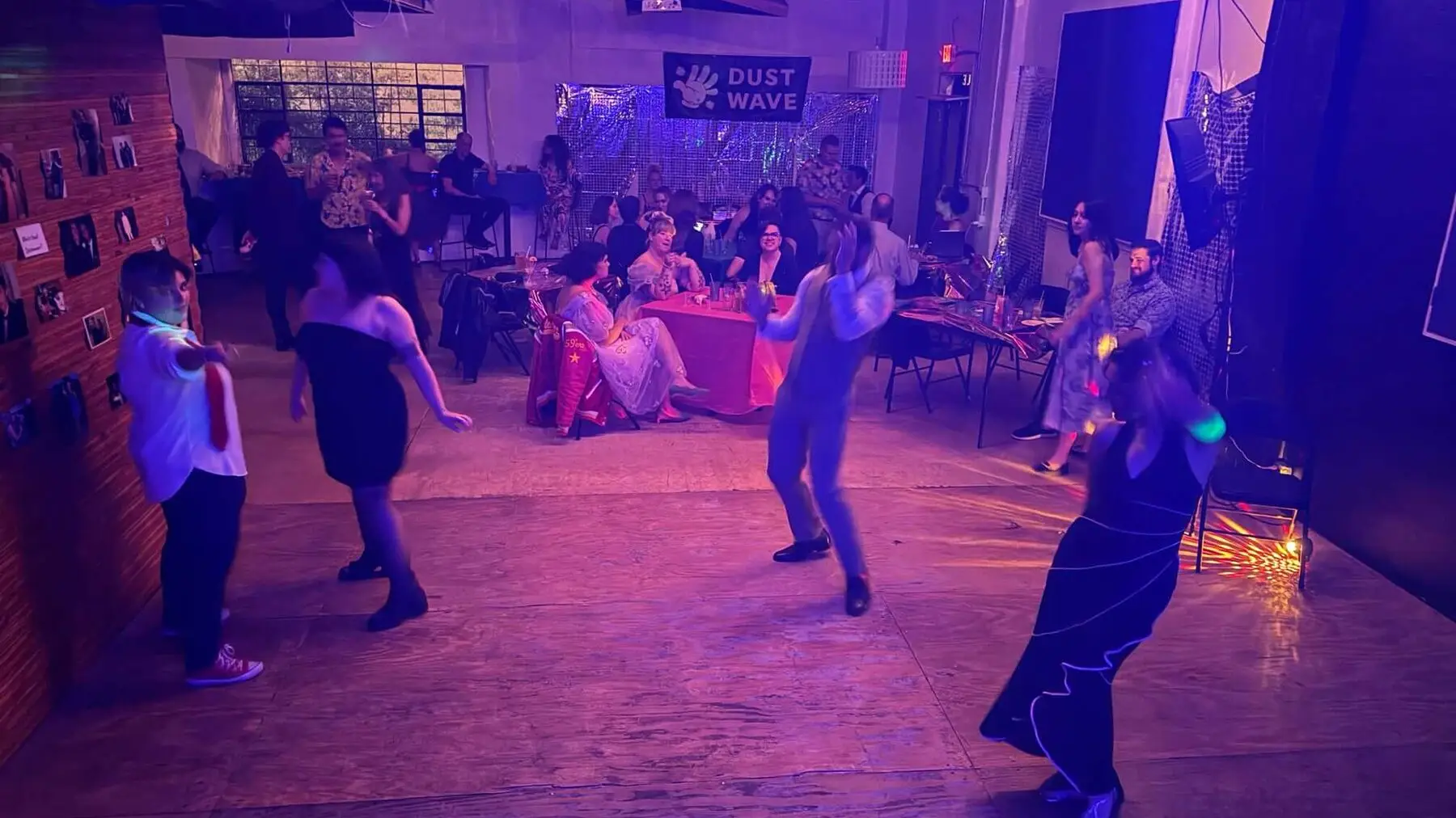Guests dance beneath purple lights at Dancewave in Juno Brewery